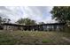 Single-story home featuring a convenient carport and a cozy front porch at 5616 Clearview Dr, Orlando, FL 32819