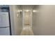 Narrow hallway with white tiled floor and doors at 5616 Clearview Dr, Orlando, FL 32819