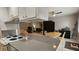 Open concept kitchen flowing into living and dining areas, perfect for entertaining at 5616 Clearview Dr, Orlando, FL 32819