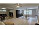 Open living room with tile floors, neutral walls, and modern ceiling fans at 5616 Clearview Dr, Orlando, FL 32819