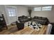 Living room features modern sofas, a stylish rug, and a bright window at 5616 Clearview Dr, Orlando, FL 32819