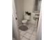 Small, standard bathroom featuring a toilet and pedestal sink at 5951 Village Cir # Ge, Orlando, FL 32822