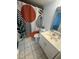 Bathroom with tile flooring featuring vanity and shower with unique curtain at 5951 Village Cir # Ge, Orlando, FL 32822