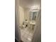 Small bathroom featuring tile flooring, decorative mirror and pedestal sink at 5951 Village Cir # Ge, Orlando, FL 32822