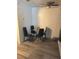 Dining area features a modern glass table with four chairs and a ceiling fan at 5951 Village Cir # Ge, Orlando, FL 32822