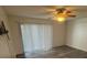 Bright living room with sliding glass doors, wood-look vinyl floors and a ceiling fan at 5951 Village Cir # Ge, Orlando, FL 32822