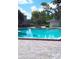 Community pool perfect for swimming and lounging in the sun at 5951 Village Cir # Ge, Orlando, FL 32822