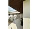 Cozy balcony area with seating, perfect for relaxing and enjoying the outdoor ambiance at 76 Windtree Ln # 201, Winter Garden, FL 34787