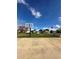 Outdoor community basketball court for residents to enjoy recreational activities with blue sky overhead at 76 Windtree Ln # 201, Winter Garden, FL 34787