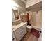 Bathroom with updated vanity, toilet, and shower/tub combination with modern fixtures at 76 Windtree Ln # 201, Winter Garden, FL 34787