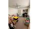 Bedroom with carpet, a ceiling fan, a closet, and built in shelving at 76 Windtree Ln # 201, Winter Garden, FL 34787