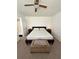 Bedroom with neutral carpeting, a platform bed, side tables, and an ottoman at 76 Windtree Ln # 201, Winter Garden, FL 34787