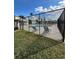 Community pool area with lounge chairs and fencing, offering a relaxing outdoor space at 76 Windtree Ln # 201, Winter Garden, FL 34787