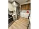 Well-equipped modern kitchen with laundry area including washer and dryer at 76 Windtree Ln # 201, Winter Garden, FL 34787