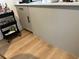 Neutral-colored kitchen with white countertops and a convenient rolling bar cart at 76 Windtree Ln # 201, Winter Garden, FL 34787
