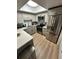 Modern kitchen featuring white countertops, stainless steel appliances and ample lighting at 76 Windtree Ln # 201, Winter Garden, FL 34787