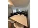 Open living and dining area featuring modern furniture and natural light at 76 Windtree Ln # 201, Winter Garden, FL 34787