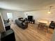 Spacious living room features modern furnishings and a dining area, ideal for entertaining and daily living at 76 Windtree Ln # 201, Winter Garden, FL 34787