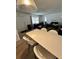 Open living room with dining area, featuring modern decor and hardwood floors at 76 Windtree Ln # 201, Winter Garden, FL 34787