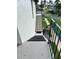 Exterior staircase leading to the unit with black railing and painted steps at 76 Windtree Ln # 201, Winter Garden, FL 34787