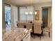 Elegant dining area featuring a wooden table, upholstered chairs, and modern lighting at 8949 Coconut Breeze Dr, Kissimmee, FL 34747