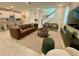 Bright, open-concept living room features modern furnishings and neutral decor at 8949 Coconut Breeze Dr, Kissimmee, FL 34747
