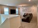 Upstairs bonus room offers a comfortable seating arrangement and stylish decor at 8949 Coconut Breeze Dr, Kissimmee, FL 34747