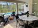 Relaxing patio with stylish outdoor furniture overlooking a sparkling swimming pool and lush landscape at 8949 Coconut Breeze Dr, Kissimmee, FL 34747