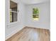 Bedroom with wood flooring and two windows bringing in natural light at 1029 Colyer St, Orlando, FL 32805