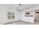 Open dining room with light floors and a pass-through to the kitchen at 1029 Colyer St, Orlando, FL 32805