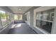 Inviting enclosed front porch with multiple windows, offering plenty of natural light and outdoor views at 1029 Colyer St, Orlando, FL 32805