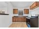 A cozy kitchen with wooden cabinets, countertops, and a modern black oven/stove at 1029 Colyer St, Orlando, FL 32805