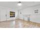 Cozy living room featuring wood floors and a decorative fireplace at 1029 Colyer St, Orlando, FL 32805