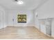 Living room with wood floors, decorative fireplace, and natural light at 1029 Colyer St, Orlando, FL 32805