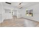 Spacious living room with light wood flooring and a stylish light fixture at 1029 Colyer St, Orlando, FL 32805