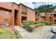 Two-story condo with a private balcony, complemented by a well-manicured lawn at 1038 E Michigan St # B, Orlando, FL 32806