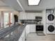Updated kitchen featuring granite countertops, white cabinets, and stainless steel appliances at 1038 E Michigan St # B, Orlando, FL 32806