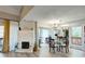 Spacious living area featuring a fireplace, dining table, and a relaxing ambiance with modern finishes and updates at 1038 E Michigan St # B, Orlando, FL 32806