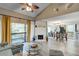 Open living space seamlessly blends a living room and dining area, enhanced by natural light and stylish decor at 1038 E Michigan St # B, Orlando, FL 32806
