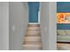 Modern staircase leading to the upper level of the home at 1038 E Michigan St # B, Orlando, FL 32806