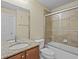 Bathroom features a shower and a sink at 1208 Bella Rose Ct, Davenport, FL 33896