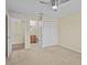 Bedroom featuring hardwood floors and ensuite bathroom access at 1208 Bella Rose Ct, Davenport, FL 33896