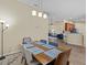 Elegant dining area open to the living room and kitchen, perfect for entertaining at 1208 Bella Rose Ct, Davenport, FL 33896