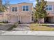 Charming townhome featuring a two-car garage, brick-paved driveway, and a well-maintained lawn at 1208 Bella Rose Ct, Davenport, FL 33896
