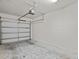 Spacious two-car garage with new garage door opener and concrete flooring at 1208 Bella Rose Ct, Davenport, FL 33896