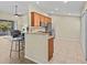 Bright kitchen with granite countertops, stainless steel appliances, and a breakfast bar at 1208 Bella Rose Ct, Davenport, FL 33896