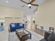 Living room featuring sleek hard wood floors, neutral paint tones and a modern aesthetic at 1208 Bella Rose Ct, Davenport, FL 33896