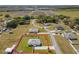 Aerial view of home highlighting property lines, showcasing a well-maintained yard in a quiet, established neighborhood at 12524 Garrett Pl, Grand Island, FL 32735