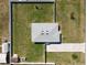 Overhead shot showcases the home's well-kept fenced yard and detached garage at 12524 Garrett Pl, Grand Island, FL 32735