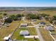 An aerial view featuring the property's location within the community and close proximity to local farmlands at 12524 Garrett Pl, Grand Island, FL 32735
